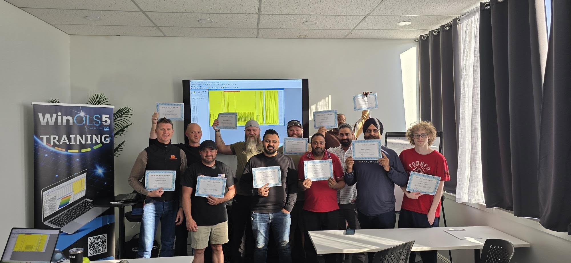 Vehicle Tuning Training with Remap 101. SEMA. US In-Person Vehicle Tuning Training. Group of successful students.